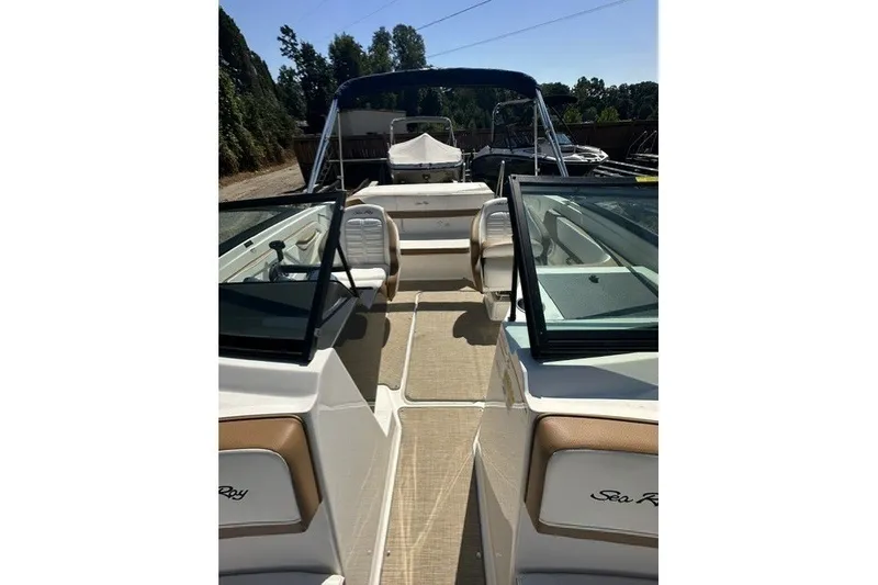 Slide: The Image of 2018 Sea Ray SPX 190 boat interior with seating and open deck. - 23