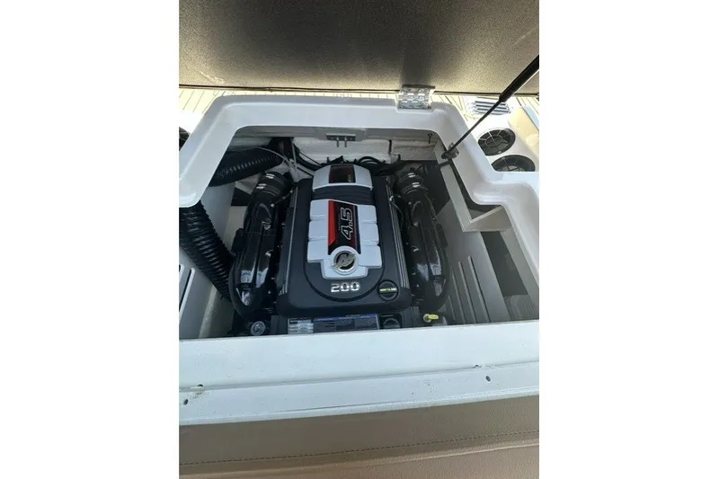 Slide: The Image of Engine compartment of 2018 Sea Ray SPX 190 boat, featuring a 4.5L 200 HP engine. - 20