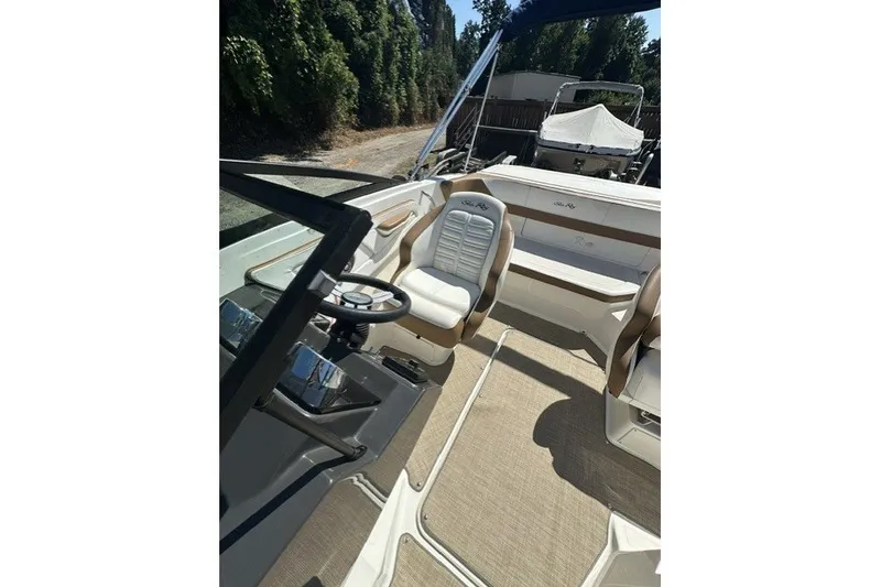 Slide: The Image of 2018 Sea Ray SPX 190 boat interior with steering wheel and seating. - 21