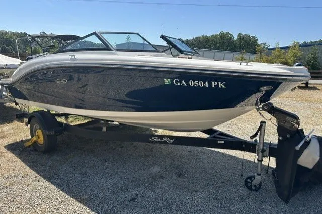Slide: The Image of 2018 Sea Ray SPX 190 boat on trailer, parked outdoors. - 13