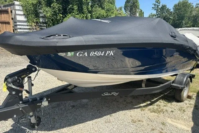 Slide: The Image of 2018 Sea Ray SPX 190 boat on trailer, covered, parked outdoors. - 14