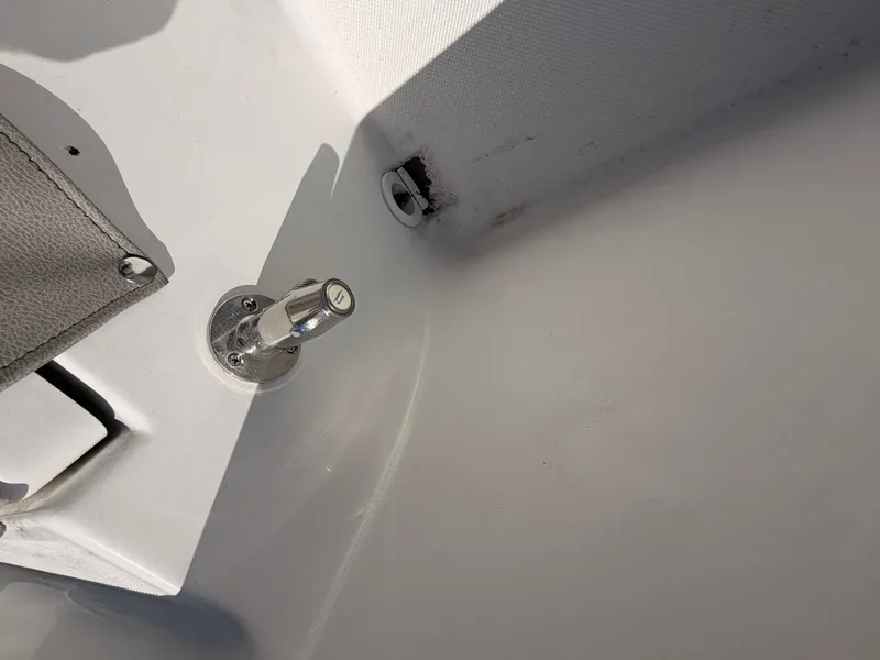 Slide: The Image of Close-up of a boat section with a metal latch and a gray cover. - 15