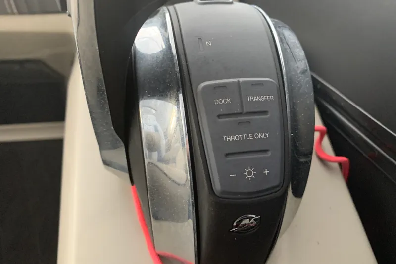 Slide: The Image of Close-up of 2022 Barletta LUSSO 25U boat throttle control panel. - 24