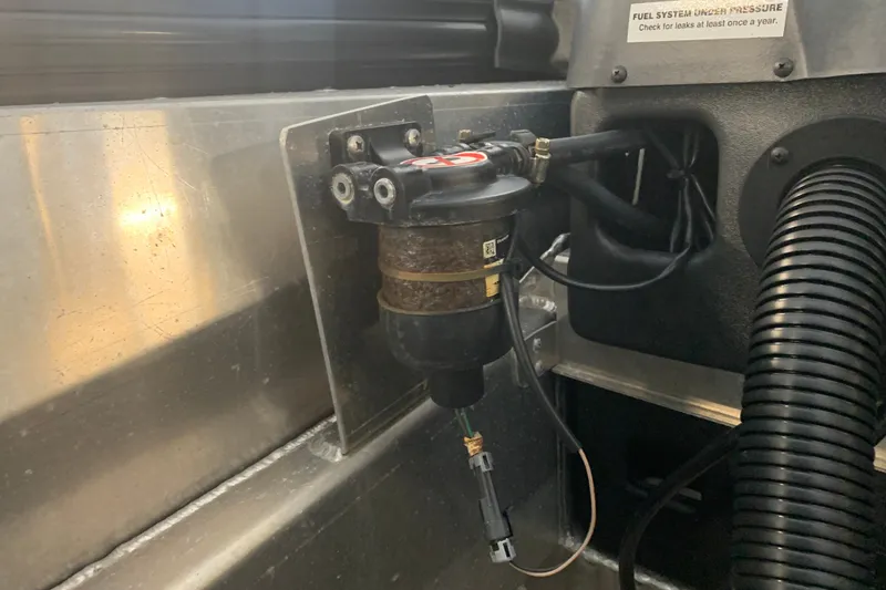 Slide: The Image of Fuel system component in a 2022 Barletta LUSSO 25U boat, highlighting pressure check instructions. - 27