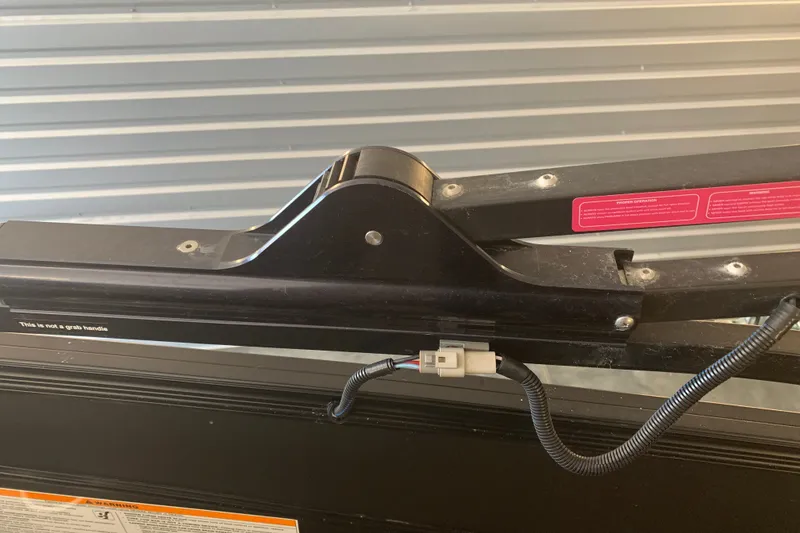 Slide: The Image of Close-up of Barletta LUSSO 25U 2022 boat component with wiring and warning label. - 23