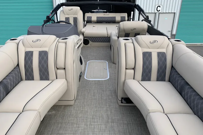 Slide: The Image of Luxurious 2022 Barletta LUSSO 25U pontoon boat interior with plush seating and elegant design. - 28
