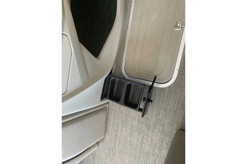 Slide: The Image of 2022 Barletta LUSSO 25U interior with cup holder and textured flooring. - 16