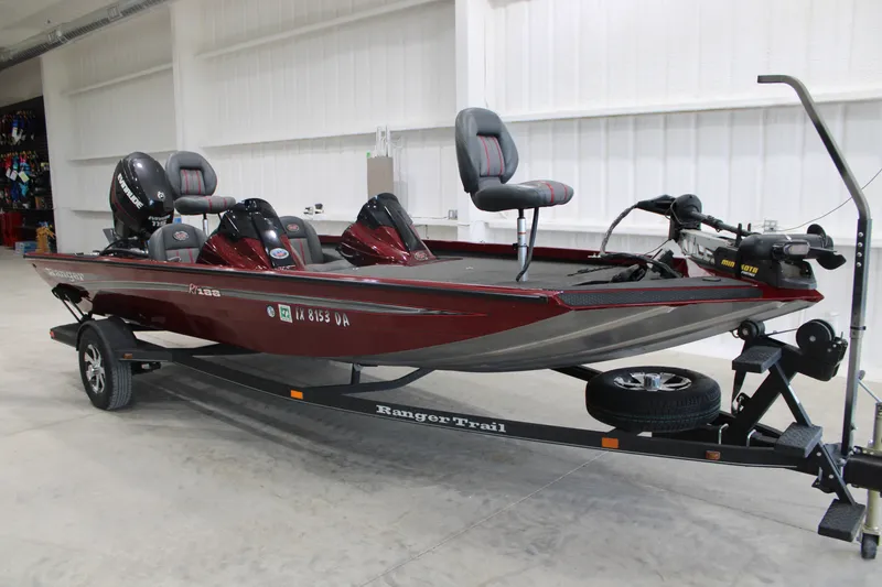 The Image of 2016 Ranger RT188 fishing boat on trailer in indoor storage. - 0