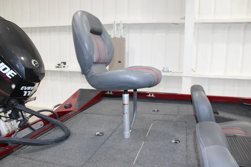 Slide: The Image of 2016 Ranger RT188 boat interior with gray seat and Evinrude motor. - 13