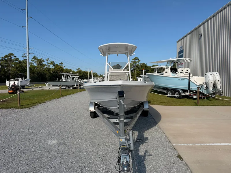 Slide: The Image of A 2027 Savannah 220 IS boat on a trailer in an outdoor setting. - 6