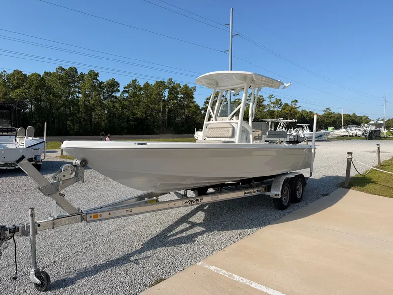 Slide: The Image of A 2027 Savannah 220 IS boat on a trailer in a parking area. - 5