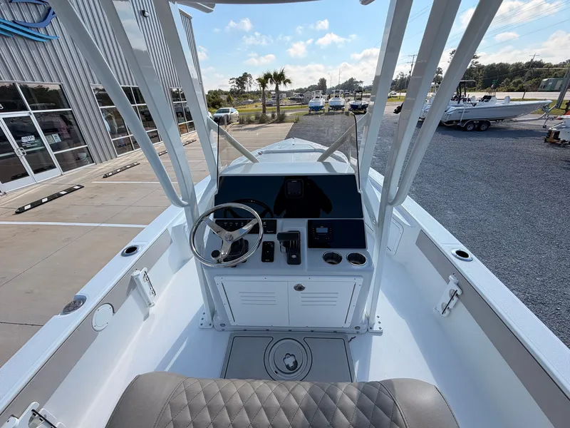 Slide: The Image of The image shows the cockpit of a 2027 Savannah 220 IS boat with a modern helm station. - 8