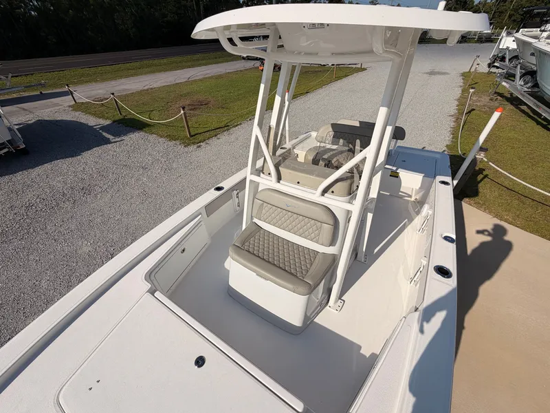 Slide: The Image of The image shows a modern boat with a central console and cushioned seating. - 11