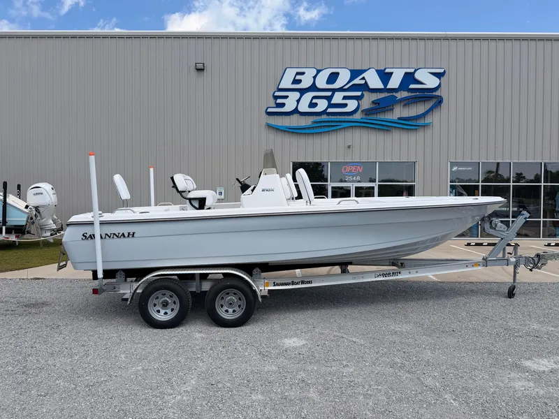The Image of A 2027 Savannah 210X boat on a trailer in front of a building with a "Boats 365" sign. - 0