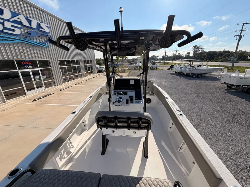 Slide: The Image of The image shows a modern boat with a central helm and cushioned seating. - 15