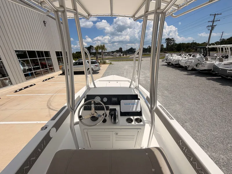 Slide: The Image of The image shows the cockpit of a 2027 Savannah 190 IS boat with steering and electronics. - 8
