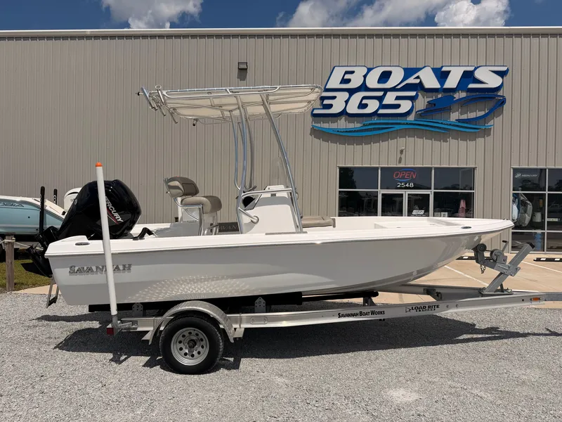 The Image of A 2027 Savannah 190 IS boat on a trailer in front of a boat dealership. - 0
