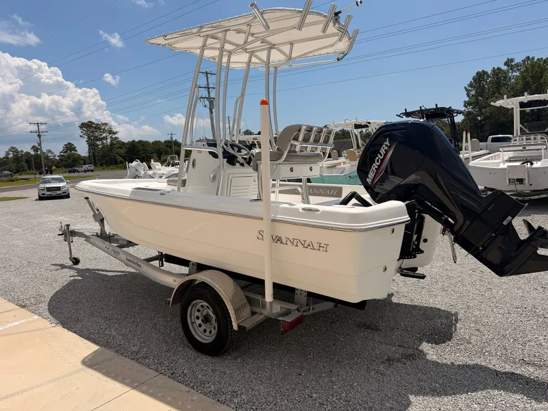 Slide: The Image of A 2027 Savannah 190 IS boat on a trailer in a gravel lot. - 3