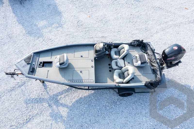 Slide: The Image of 2019 Tracker Pro Team 190 TX fishing boat, aerial view, on gravel surface. - 29