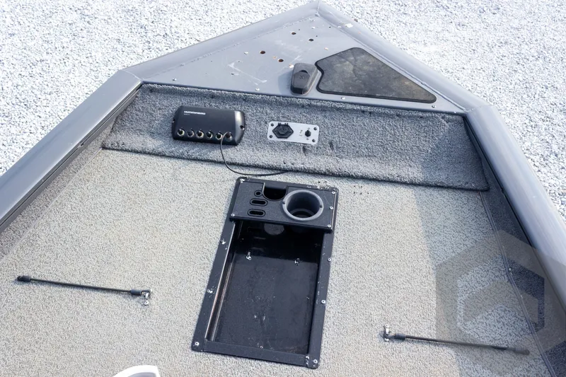 Slide: The Image of 2019 Tracker Pro Team 190 TX boat deck with control panel and storage compartment. - 20
