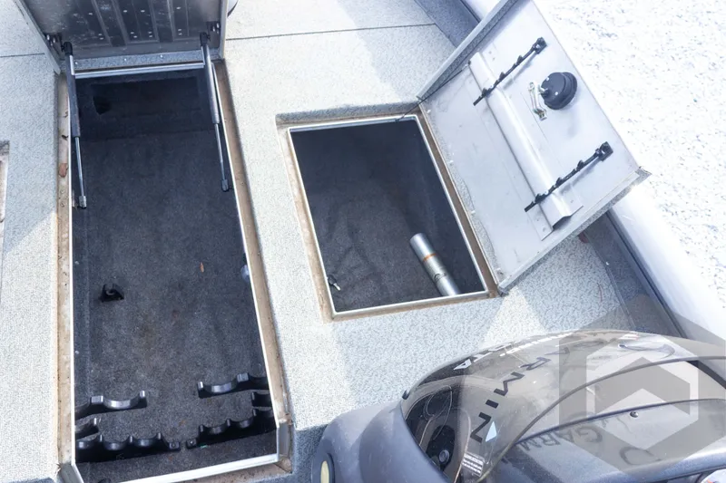 Slide: The Image of 2019 Tracker Pro Team 190 TX boat storage compartments open, showcasing interior space. - 19