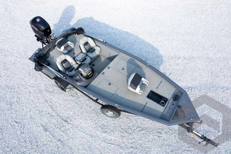 Slide: The Image of 2019 Tracker Pro Team 190 TX fishing boat on gravel surface, aerial view. - 34