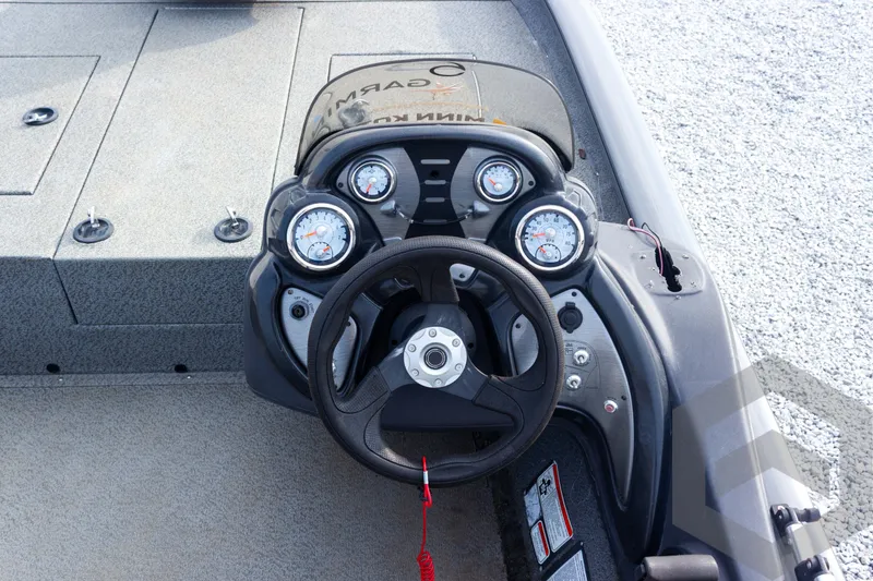 Slide: The Image of 2019 Tracker Pro Team 190 TX boat dashboard with steering wheel and gauges. - 22