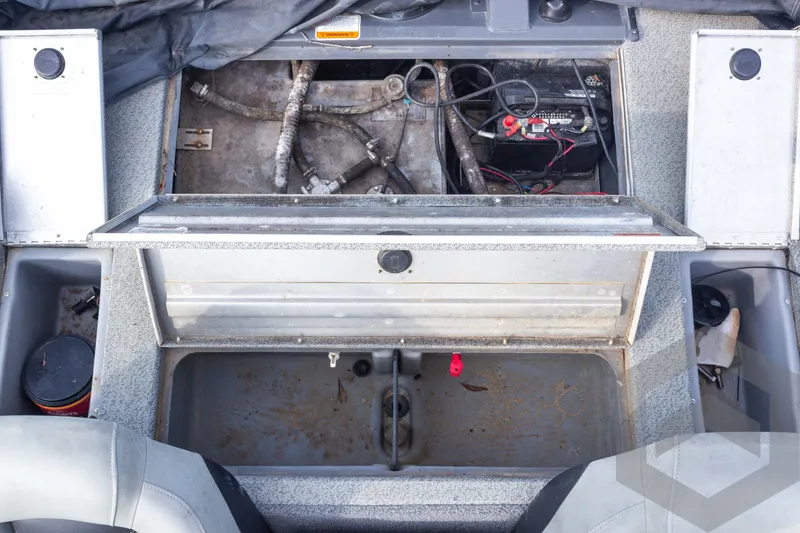 Slide: The Image of 2019 Tracker Pro Team 190 TX boat interior showing battery compartment and storage area. - 24