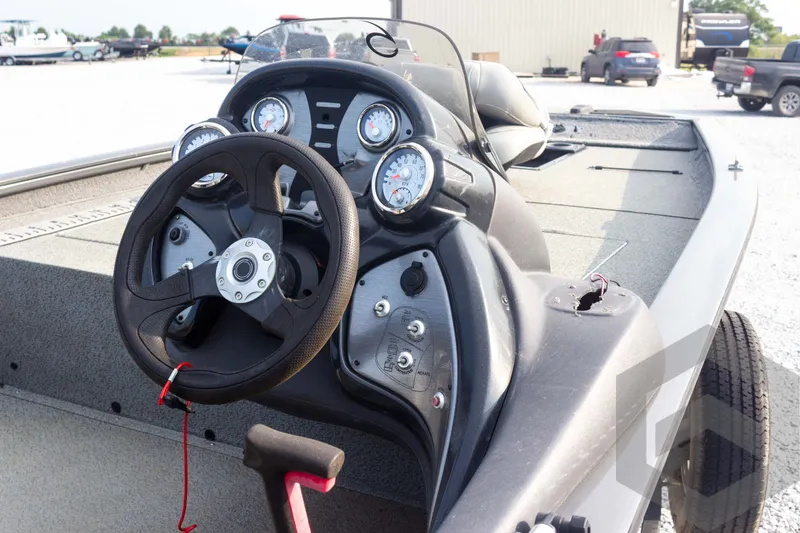 Slide: The Image of 2019 Tracker Pro Team 190 TX boat dashboard with steering wheel and gauges. - 15
