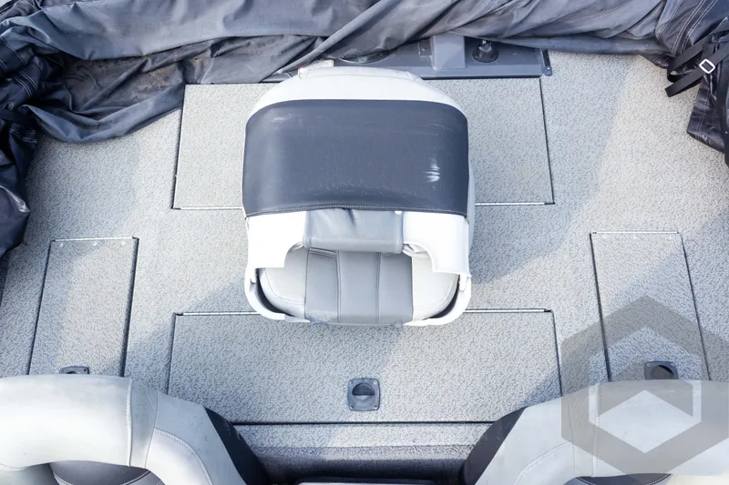 Slide: The Image of 2019 Tracker Pro Team 190 TX boat interior with gray seating and storage compartments. - 23