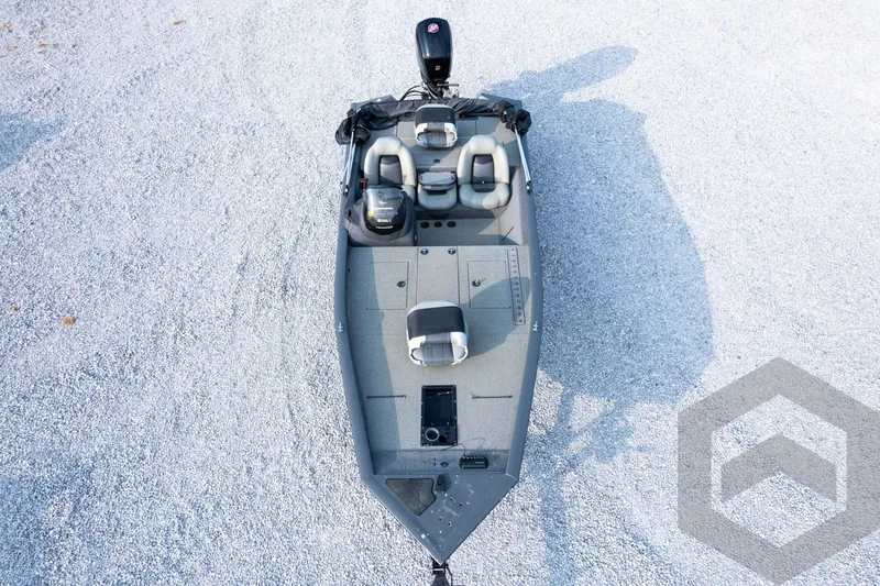 Slide: The Image of 2019 Tracker Pro Team 190 TX fishing boat on gravel surface, aerial view. - 35