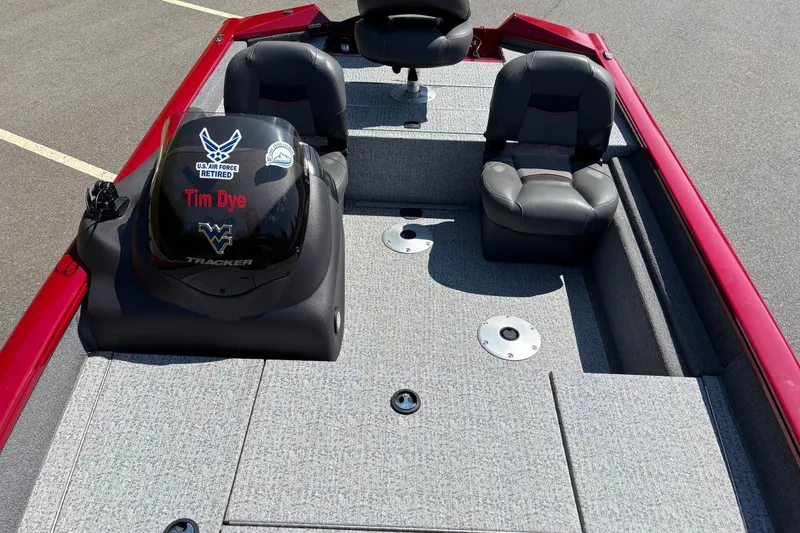 Slide: The Image of 2024 Tracker Pro Team 175 TF boat interior with seating and motor details. - 17