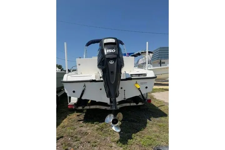 Slide: The Image of 2008 Boston Whaler 180 Dauntless boat with 150 HP outboard motor, rear view. - 8
