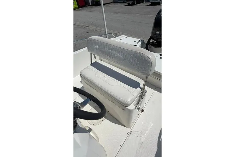 Slide: The Image of 2008 Boston Whaler 180 Dauntless boat interior with white seating and steering wheel. - 20