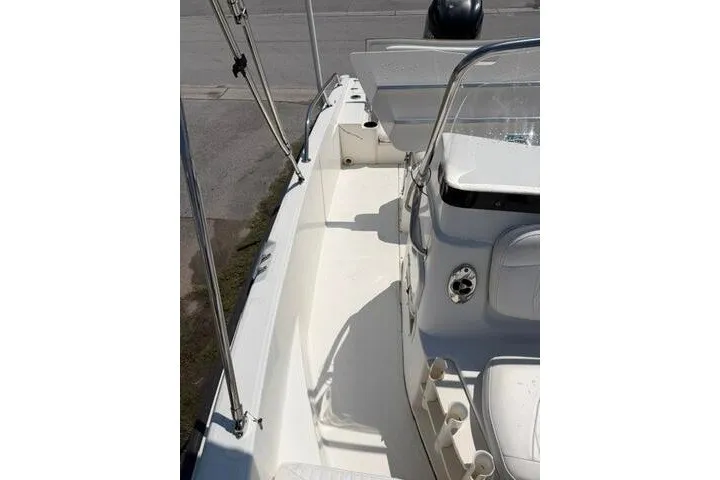 Slide: The Image of 2008 Boston Whaler 180 Dauntless boat interior with seating and console. - 13