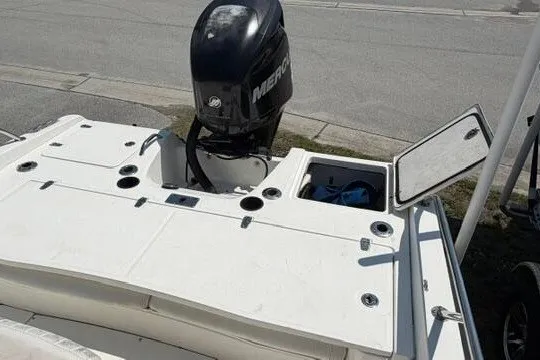 Slide: The Image of 2008 Boston Whaler 180 Dauntless boat with Mercury outboard motor, open storage compartment. - 23