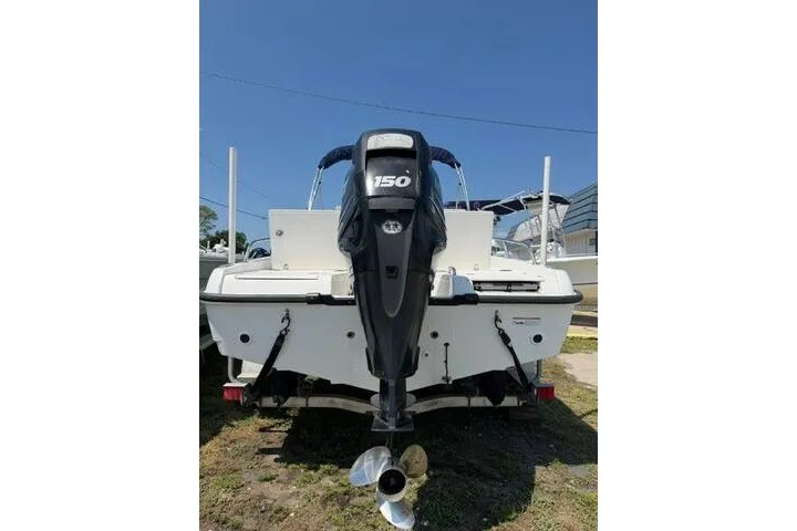 Slide: The Image of 2008 Boston Whaler 180 Dauntless boat with 150 HP outboard motor, rear view. - 6