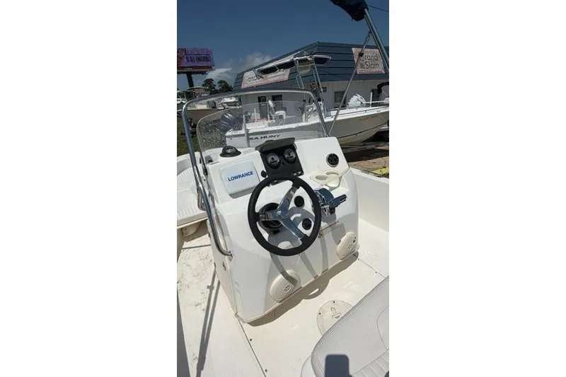 Slide: The Image of 2008 Boston Whaler 180 Dauntless boat console with steering wheel and Lowrance equipment. - 19