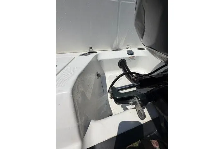 Slide: The Image of 2008 Boston Whaler 180 Dauntless boat interior with engine detail. - 9