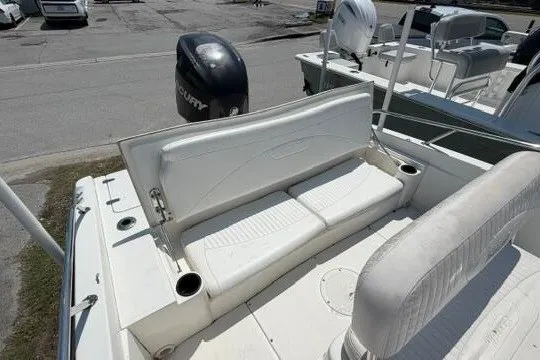Slide: The Image of 2008 Boston Whaler 180 Dauntless boat interior with seating and motor view. - 15