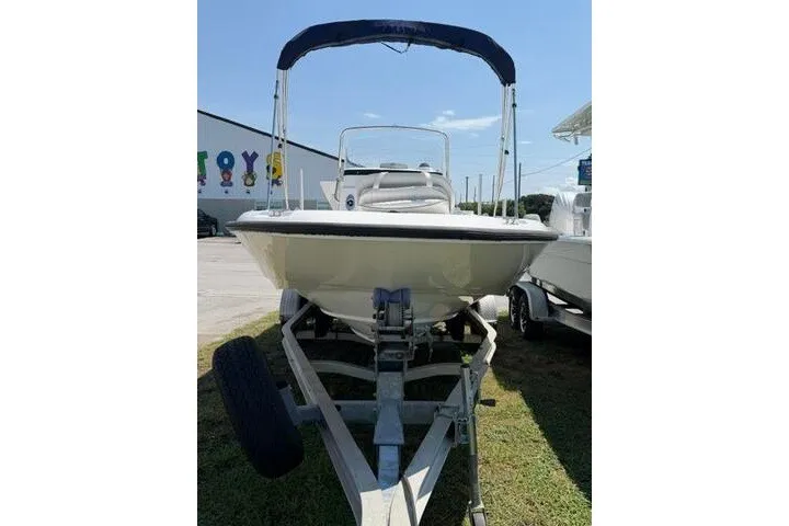 Slide: The Image of 2008 Boston Whaler 180 Dauntless boat on trailer with blue canopy. - 3