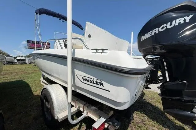 Slide: The Image of 2008 Boston Whaler 180 Dauntless boat on trailer with Mercury outboard motor. - 10