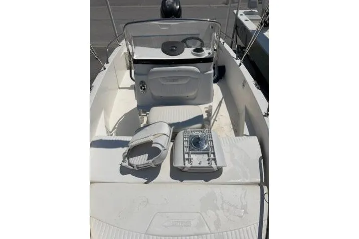 Slide: The Image of 2008 Boston Whaler 180 Dauntless boat interior with steering console and seating. - 12