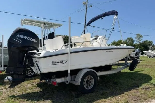 Slide: The Image of 2008 Boston Whaler 180 Dauntless boat on trailer with Mercury outboard engine. - 1