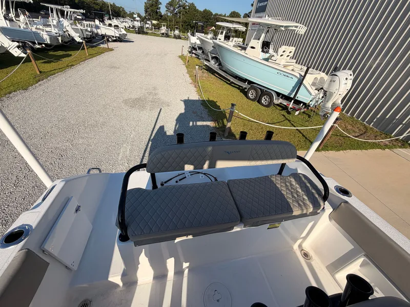 Slide: The Image of The image shows the stern of a 2027 Savannah 2200 Offshore boat with cushioned seating. - 16
