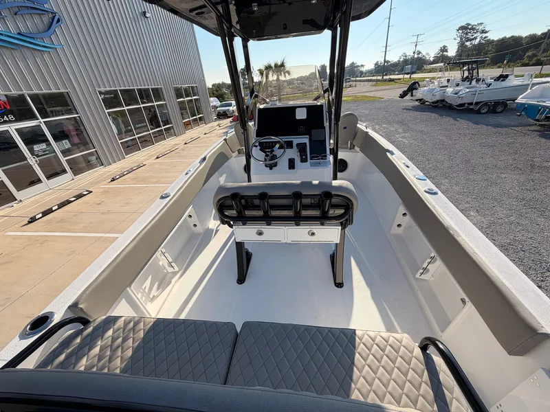 Slide: The Image of The image shows a modern boat with an open deck and a central helm console. - 17