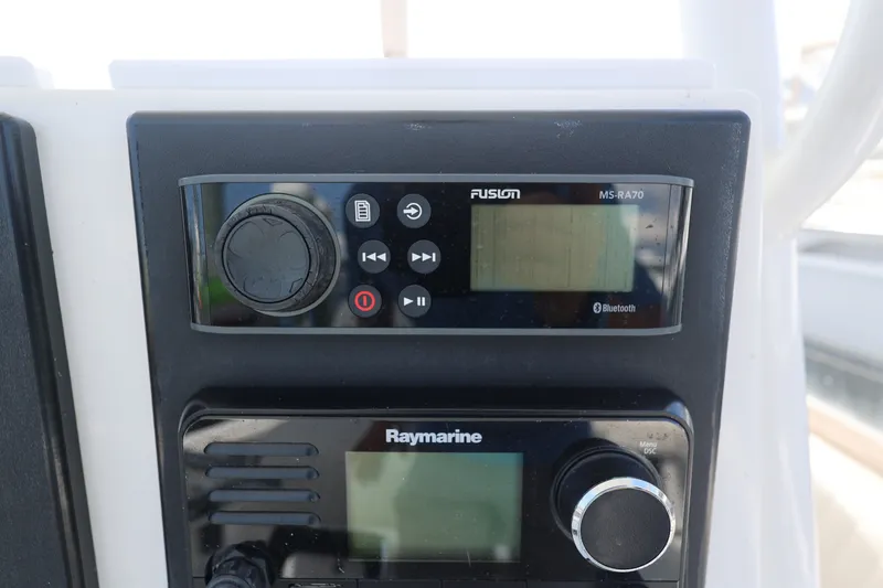 Slide: The Image of Fusion MS-RA70 and Raymarine controls on 1999 Regulator 26 Forward Seating boat. - 20