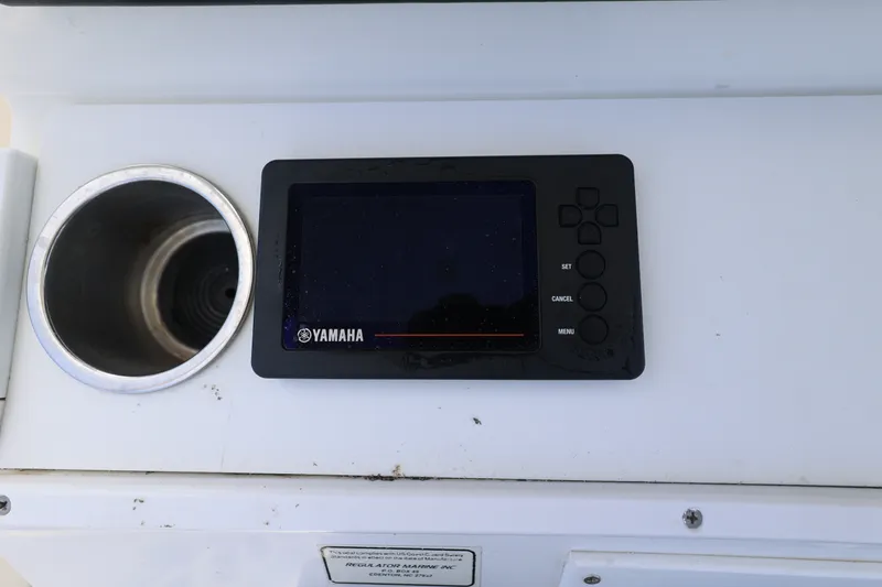 Slide: The Image of A control panel with a Yamaha screen and a cup holder beside it. - 21