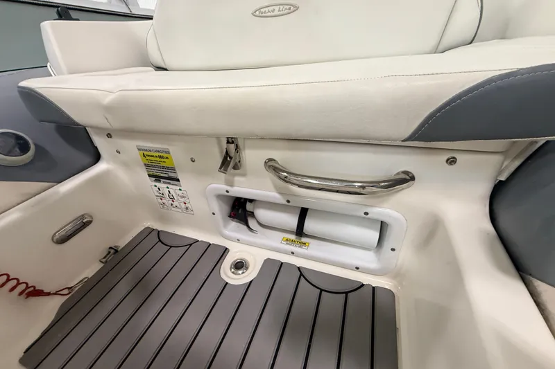 Slide: The Image of Interior view of a 2013 Zodiac Yachtline 2 Deluxe 340 boat, featuring seating and storage. - 6