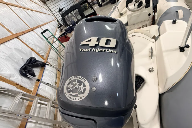 Slide: The Image of 2013 Zodiac Yachtline 2 Deluxe 340 with 40HP fuel injection engine in storage. - 7